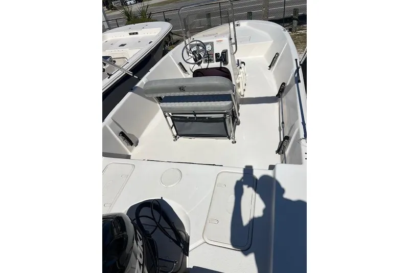 Slide: The Image of 2024 Carolina Skiff EV198 Sea Skiff boat interior with steering console and seating. - 3
