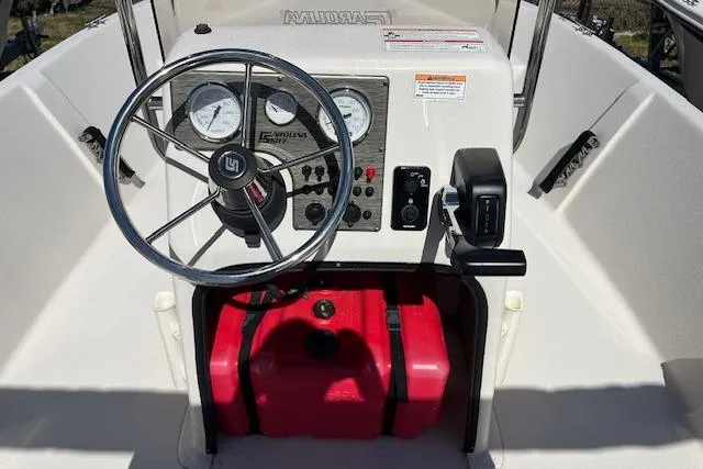 Slide: The Image of 2024 Carolina Skiff EV198 Sea Skiff dashboard with steering wheel and controls. - 6
