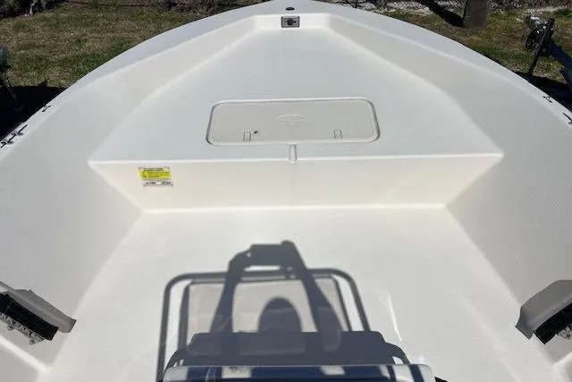 Slide: The Image of 2024 Carolina Skiff EV198 Sea Skiff boat interior, featuring spacious white deck design. - 7