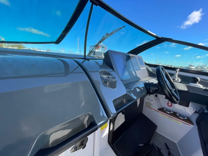 Slide: The Image of Cockpit view of 2020 Aviara AV32 I/O boat with modern dashboard and steering wheel. - 14