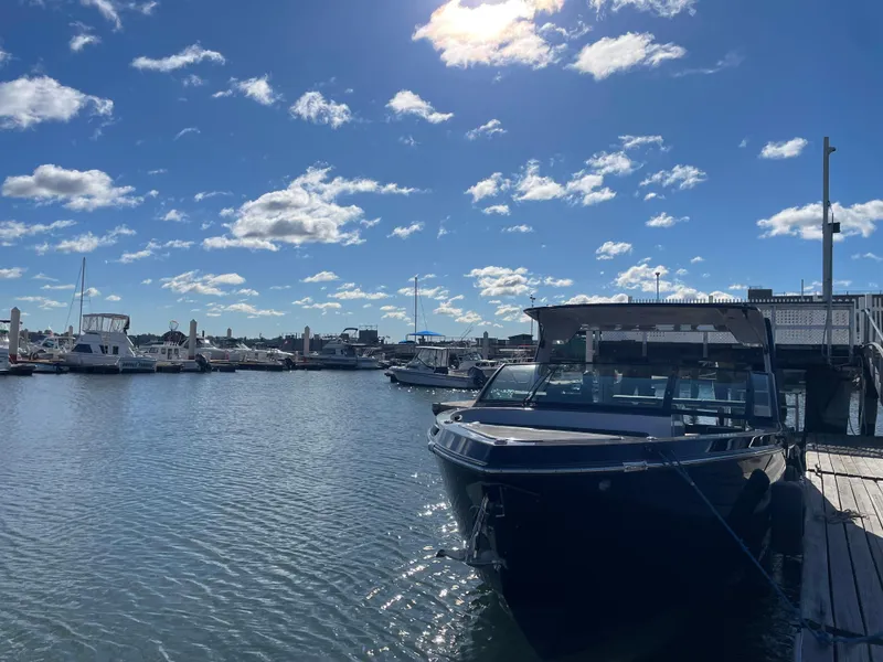 Slide: The Image of Aviara AV32 I/O 2020 boat docked at a sunny marina with blue sky. - 2