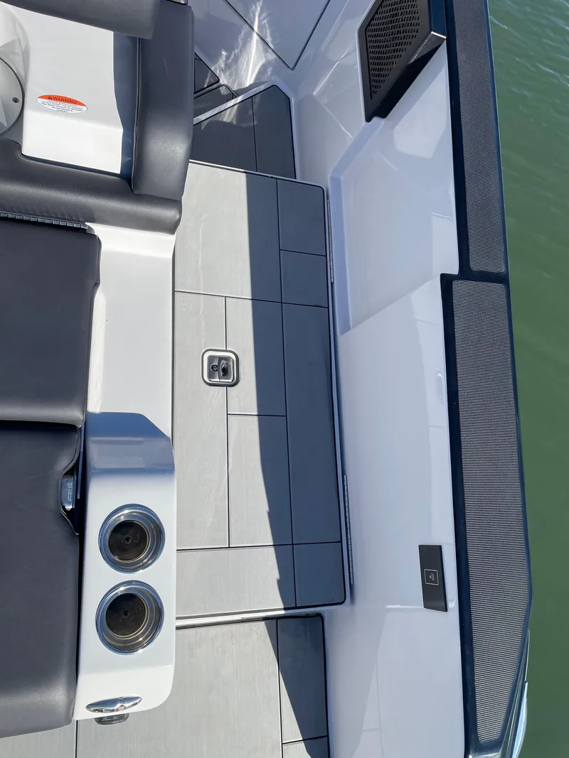 Slide: The Image of 2020 Aviara AV32 I/O boat deck with sleek seating and cup holders. - 20