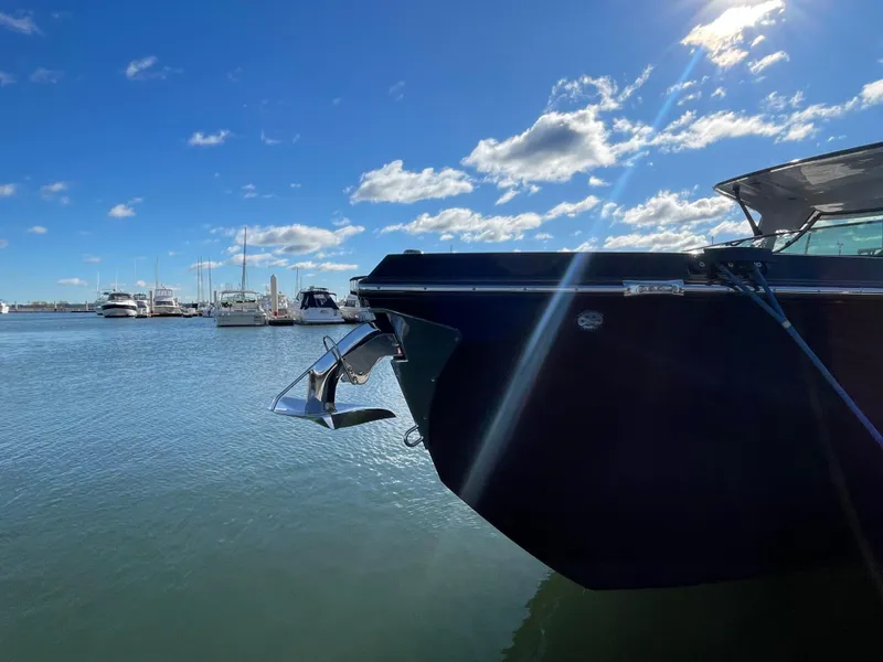 Slide: The Image of 2020 Aviara AV32 I/O boat docked in a sunny marina. - 7