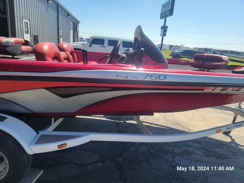 Slide: The Image of 2004 Nitro NX 750 SC boat on trailer, red and silver, side view. - 1