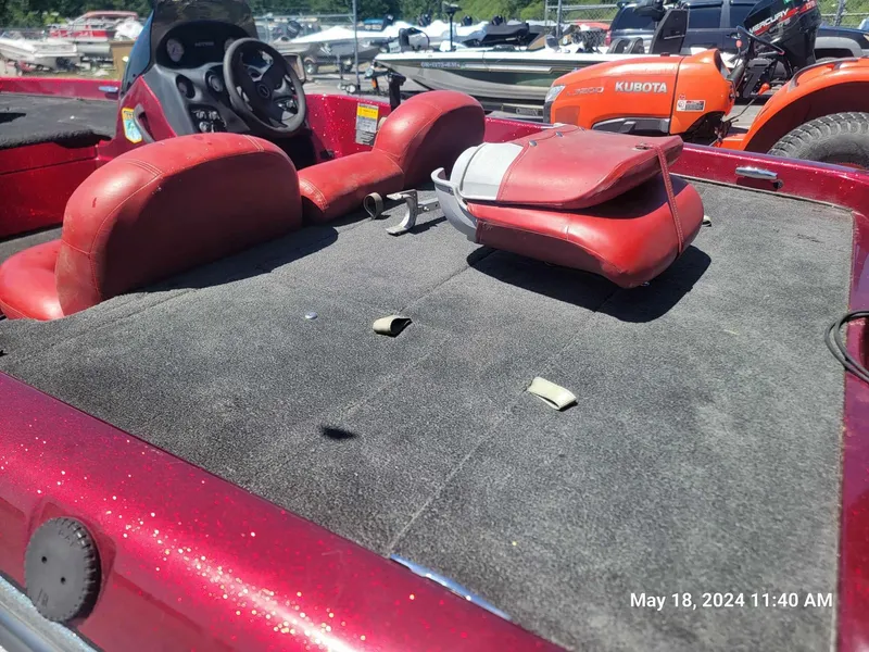 Slide: The Image of 2004 Nitro NX 750 SC boat interior with red seats and steering wheel. - 12