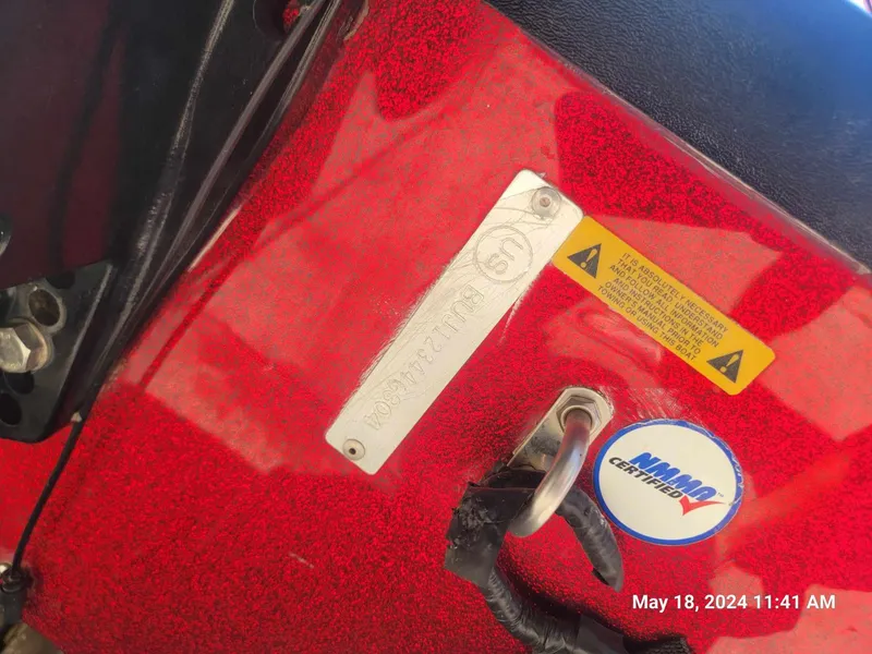Slide: The Image of Close-up of a 2004 Nitro NX 750 SC boat with a Minn Kota sticker. - 13