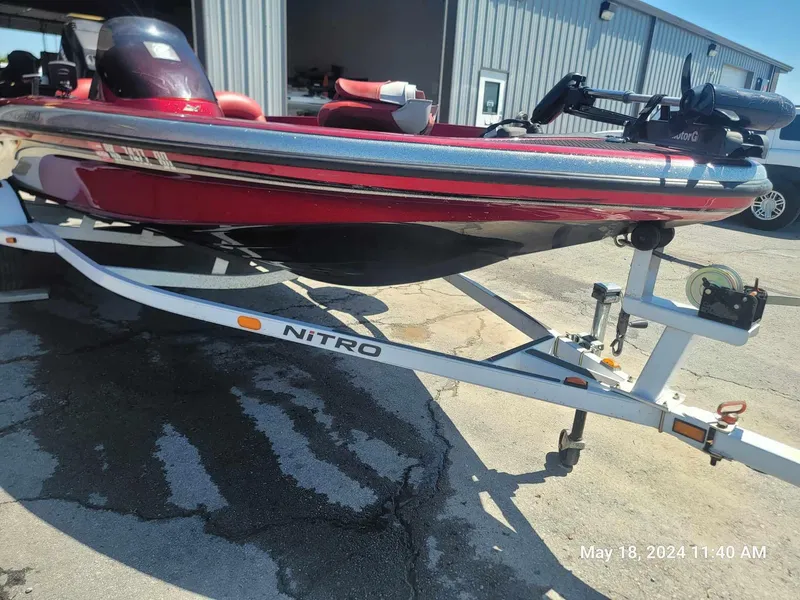 Slide: The Image of 2004 Nitro NX 750 SC red fishing boat on trailer. - 3