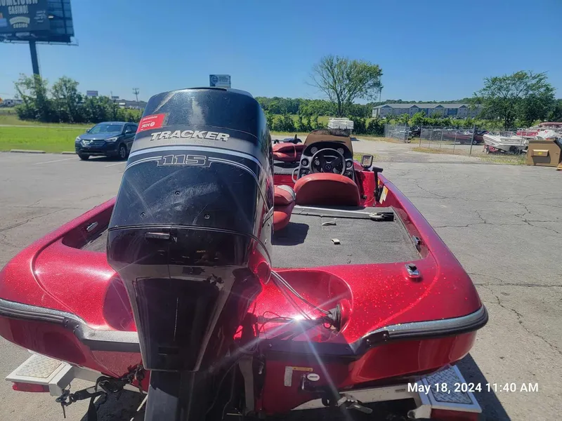 Slide: The Image of 2004 Nitro NX 750 SC red fishing boat with Tracker outboard motor. - 6