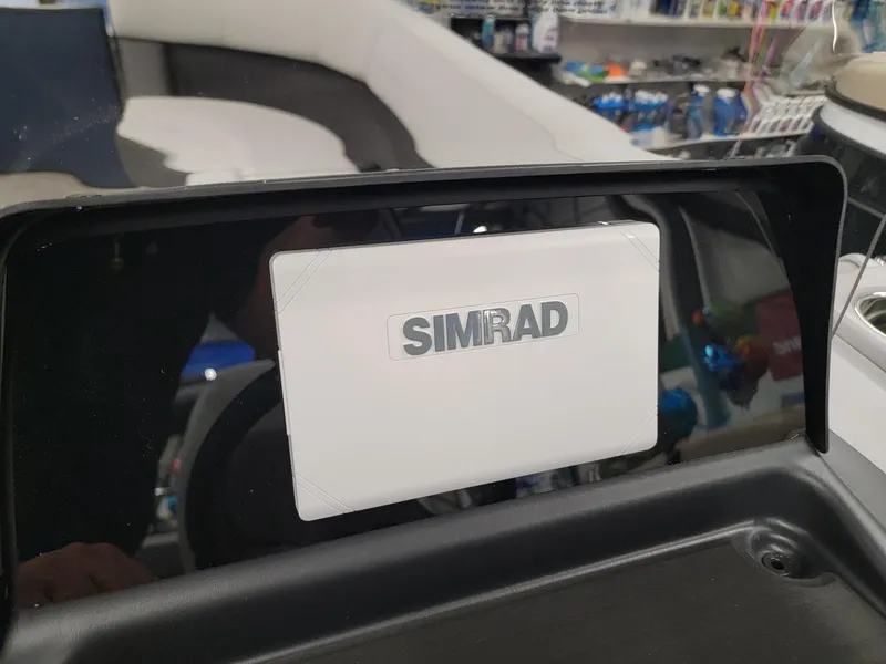 Slide: The Image of 2024 Harris Cruiser 230 boat with Simrad navigation system. - 11