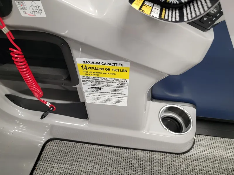 Slide: The Image of 2024 Harris Cruiser 230 boat capacity label, 14 persons or 1930 lbs. - 14