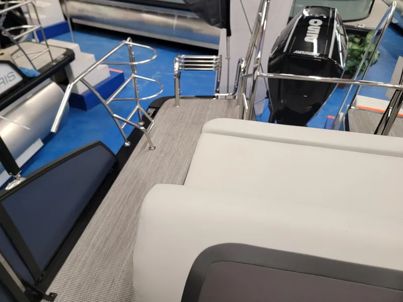 Slide: The Image of 2024 Harris Cruiser 230 boat interior with seating and outboard motor. - 17