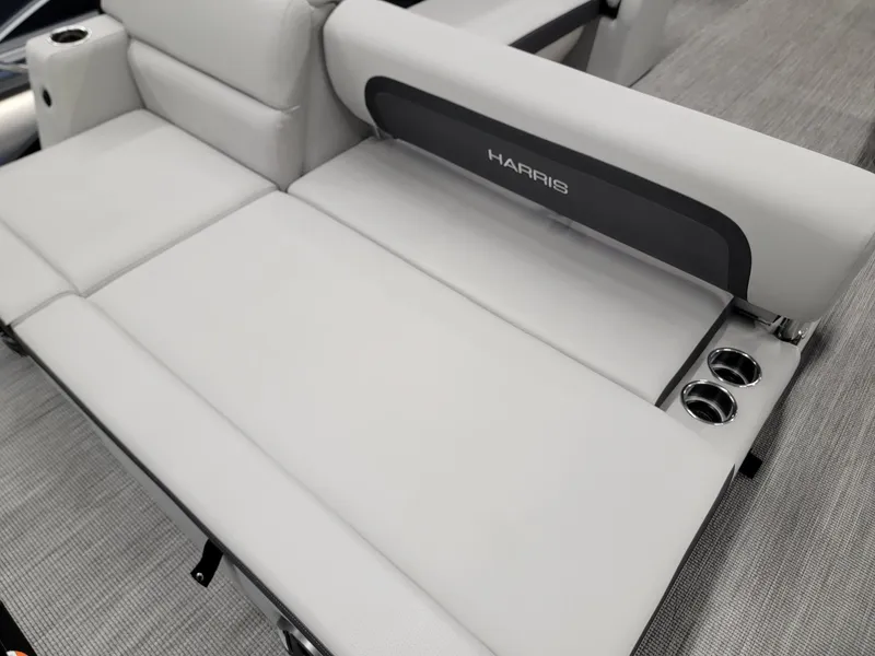 Slide: The Image of 2024 Harris Cruiser 230 boat interior seating with cup holders. - 19