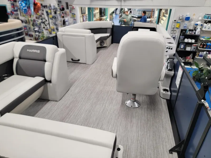 Slide: The Image of 2024 Harris Cruiser 230 boat interior with plush seating and modern amenities. - 21