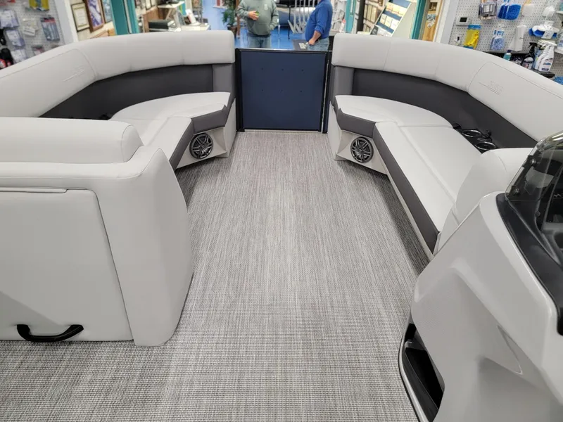 Slide: The Image of 2024 Harris Cruiser 230 boat interior with spacious seating and modern design. - 23