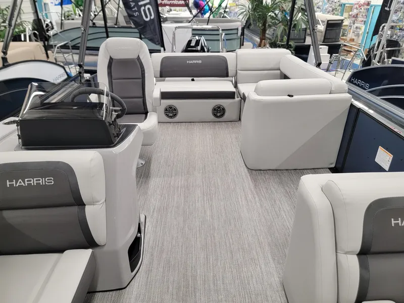 Slide: The Image of 2024 Harris Cruiser 230 pontoon boat interior with gray seating and modern design. - 5