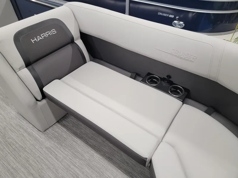 Slide: The Image of 2024 Harris Cruiser 230 boat interior seating with cup holders. - 7