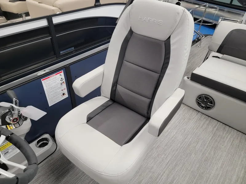 Slide: The Image of 2024 Harris Cruiser 230 boat captain's chair with gray and white upholstery. - 9