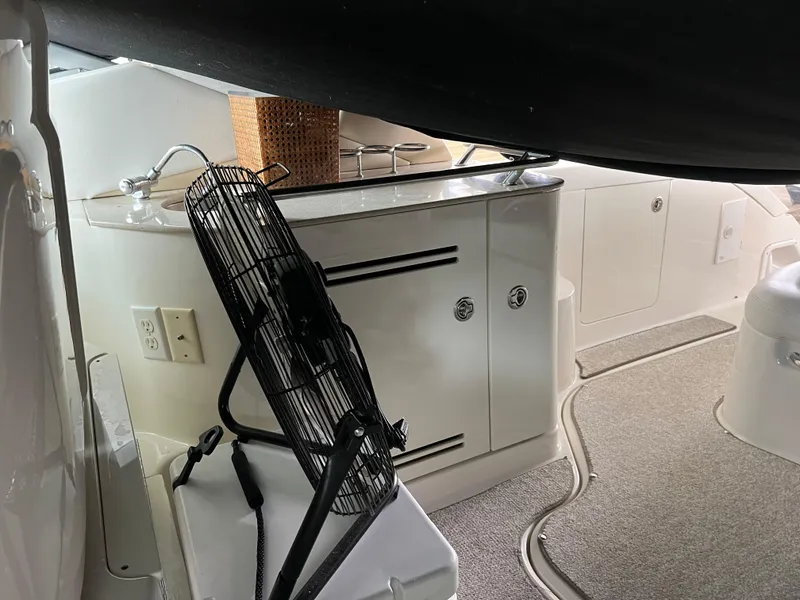 Slide: The Image of Interior of 2008 Sea Ray 350 Sundancer with fan and kitchenette area. - 12