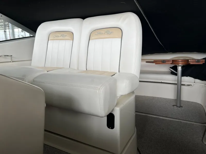 Slide: The Image of Interior seating of 2008 Sea Ray 350 Sundancer boat with white leather upholstery. - 13