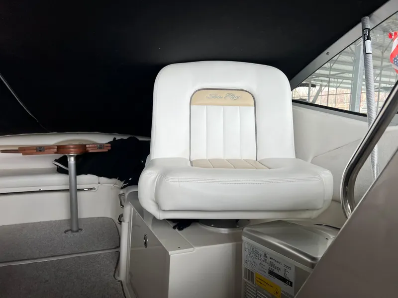 Slide: The Image of Captain's chair on 2008 Sea Ray 350 Sundancer boat, white upholstery, indoor cabin view. - 14