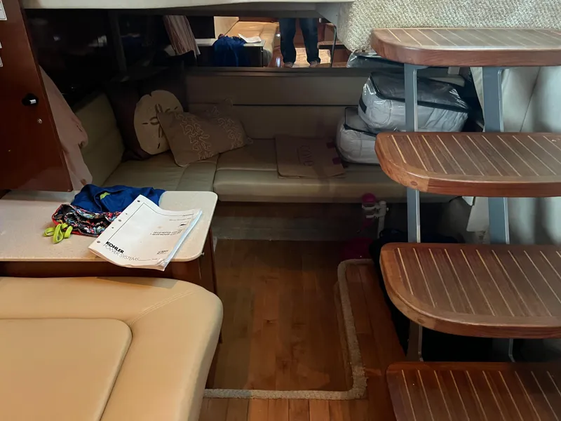 Slide: The Image of Interior of 2008 Sea Ray 350 Sundancer with wooden steps and seating area. - 19