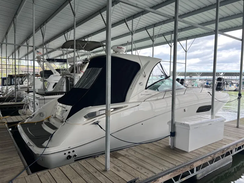 Slide: The Image of 2008 Sea Ray 350 Sundancer docked in a covered marina. - 25