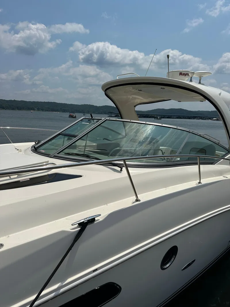 Slide: The Image of 2008 Sea Ray 350 Sundancer yacht on a sunny day, docked by the water. - 3