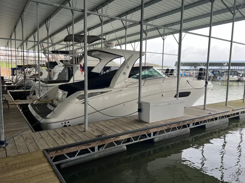 Slide: The Image of 2008 Sea Ray 350 Sundancer docked in a covered marina. - 4