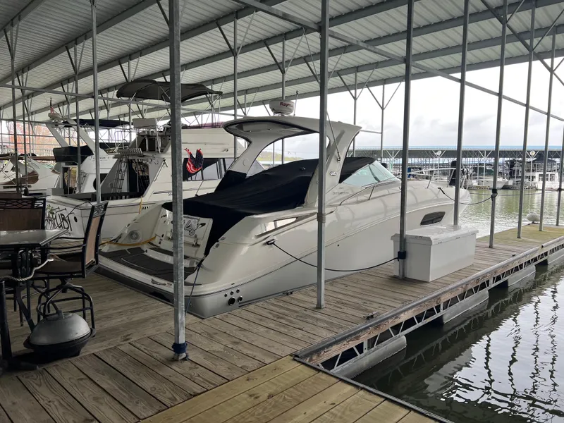 Slide: The Image of 2008 Sea Ray 350 Sundancer docked in a covered marina. - 6