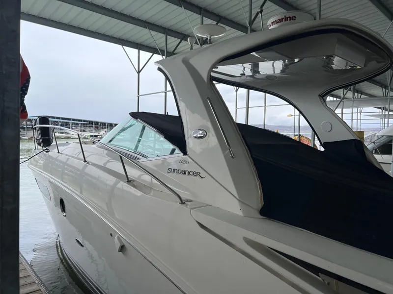 Slide: The Image of 2008 Sea Ray 350 Sundancer docked in a covered marina. - 9