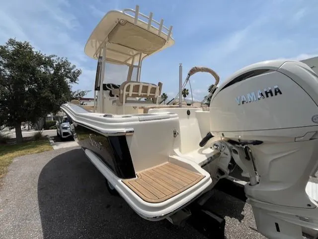 Slide: The Image of 2024 Scout 215XSF boat with Yamaha engine, rear view. - 2