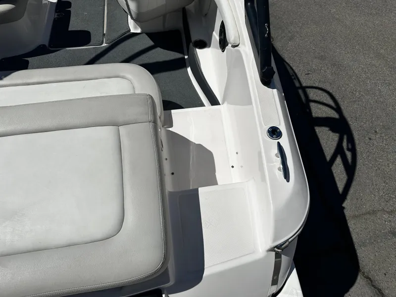 Slide: The Image of 2018 Regal 1900 ES Bowrider interior, featuring white and gray seating and deck. - 11