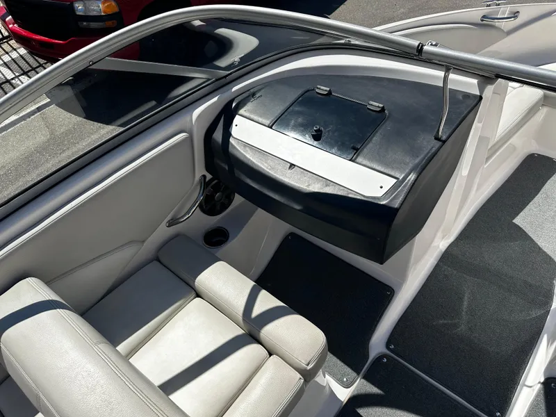Slide: The Image of 2018 Regal 1900 ES Bowrider interior cockpit with seating and dashboard. - 14