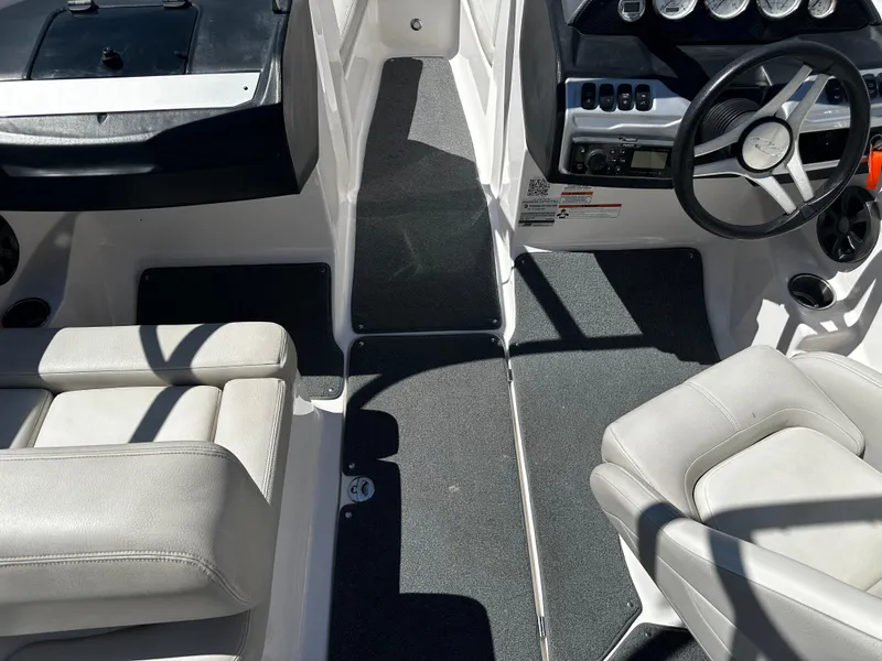Slide: The Image of 2018 Regal 1900 ES Bowrider interior with steering wheel and seating. - 16