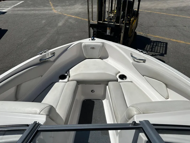 Slide: The Image of 2018 Regal 1900 ES Bowrider interior with white seating and cup holders. - 17