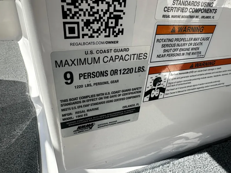 Slide: The Image of 2018 Regal 1900 ES Bowrider capacity label, 9 persons or 1220 lbs, U.S. Coast Guard compliant. - 18