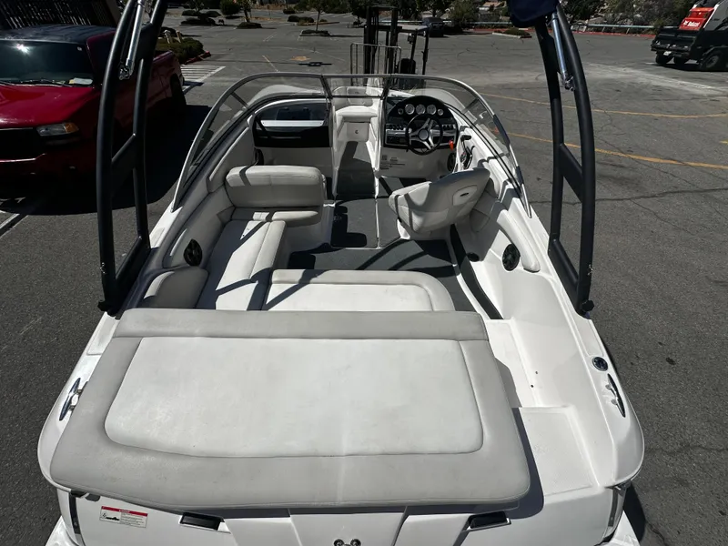 Slide: The Image of 2018 Regal 1900 ES Bowrider boat interior with seating and dashboard. - 9