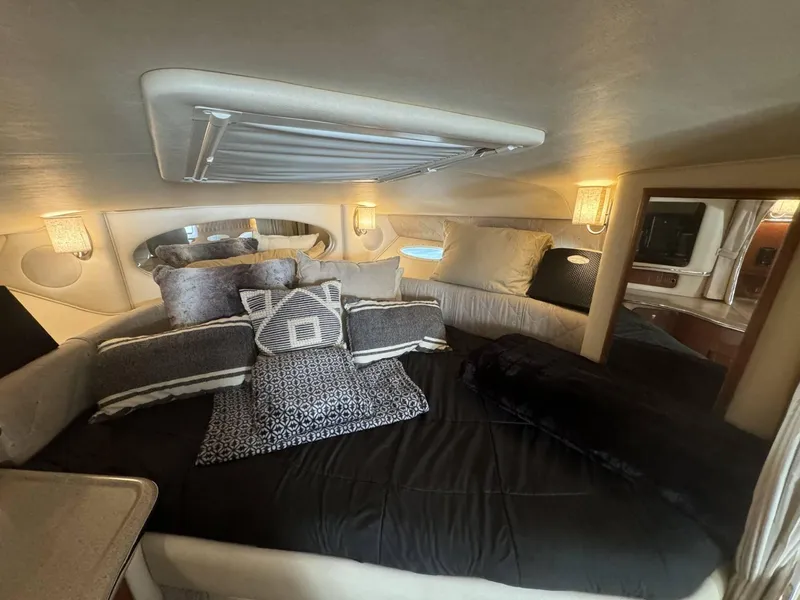 Slide: The Image of Luxurious cabin interior of a 2002 Sea Ray 310 Sundancer yacht with cozy bedding. - 3