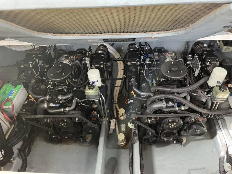 Slide: The Image of Engine compartment of a 2002 Sea Ray 310 Sundancer boat with dual engines. - 9