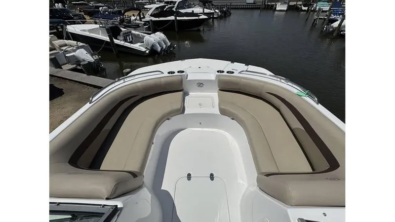 Slide: The Image of 2022 Hurricane SD 187 boat with spacious seating at a marina. - 3
