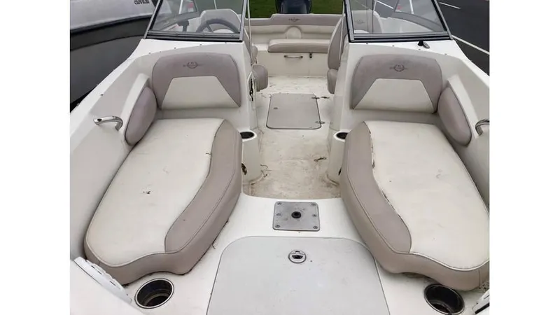 Slide: The Image of 2019 Stingray 190 DC boat interior with beige and white seating. - 5