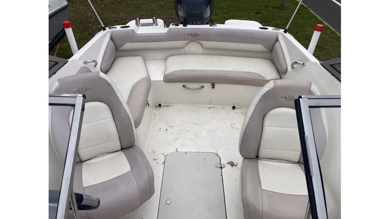 Slide: The Image of 2019 Stingray 190 DC boat interior with white and beige seating. - 8