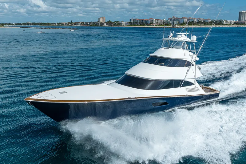 Slide: The Image of 2018 Viking 92 Sky Bridge yacht cruising on open water. - 0