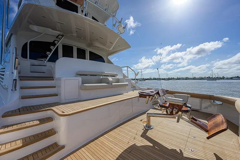 Slide: The Image of 2018 Viking 92 Sky Bridge yacht deck with fishing chairs and ocean view. - 10