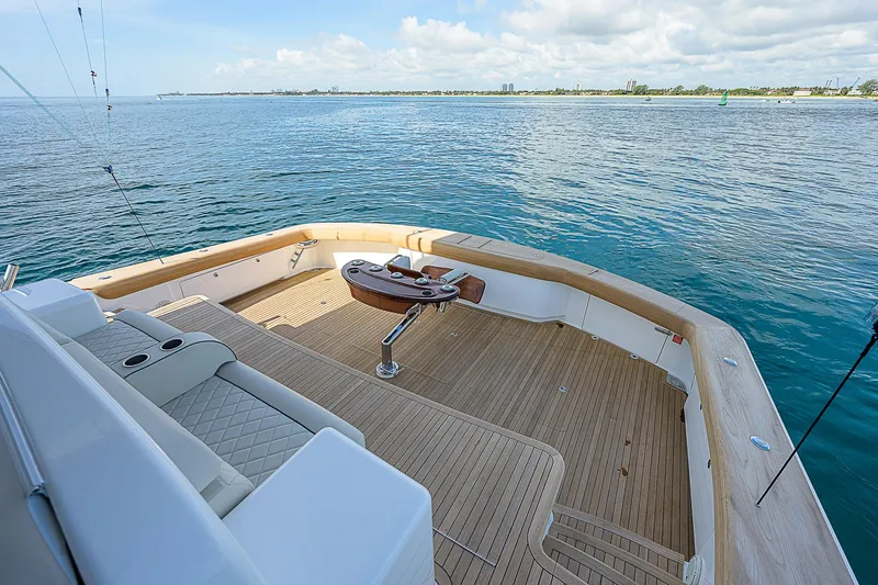 Slide: The Image of 2018 Viking 92 Sky Bridge yacht deck with ocean view. - 11