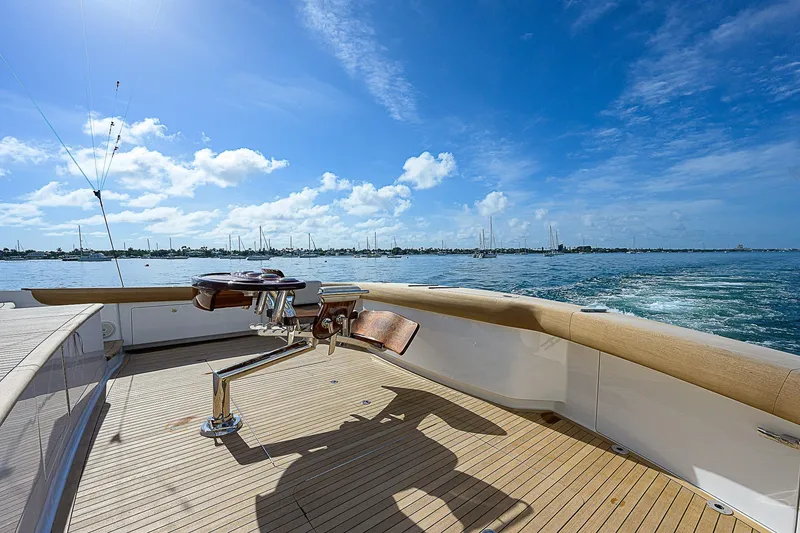 Slide: The Image of 2018 Viking 92 Sky Bridge yacht deck with ocean view and clear blue sky. - 15