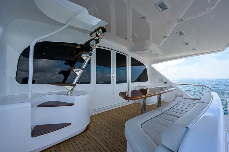 Slide: The Image of Luxurious 2018 Viking 92 Sky Bridge yacht with elegant seating and ocean view. - 18