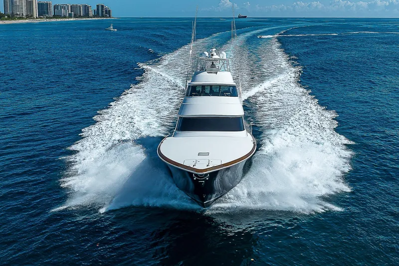 Slide: The Image of 2018 Viking 92 Sky Bridge yacht cruising on open water. - 2