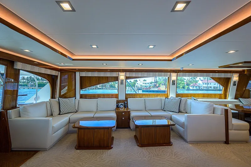 Slide: The Image of Luxurious interior of 2018 Viking 92 Sky Bridge yacht with white sofas and wooden accents. - 24