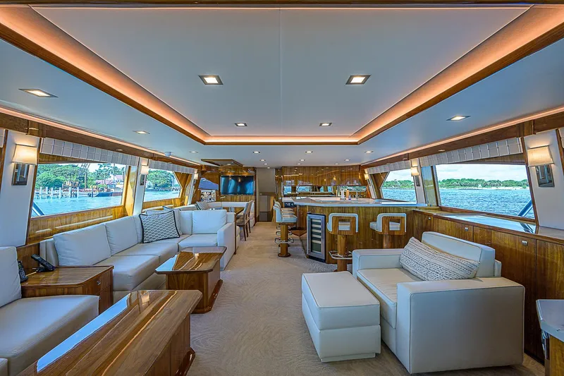 Slide: The Image of Luxurious interior of 2018 Viking 92 Sky Bridge yacht with modern furnishings and panoramic windows. - 26